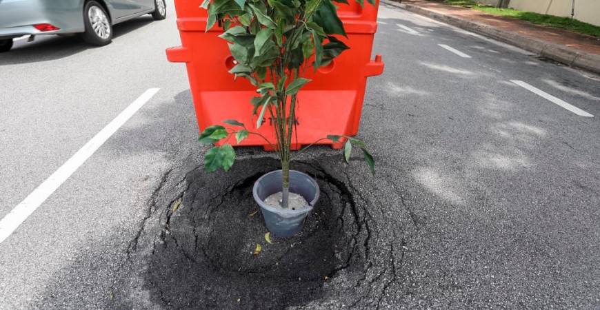 Many road users have suffered vehicle damage, bodily injuries, and some have even lost their lives due to long-unrepaired potholes and road iron covers that sit lower than the road surface. – THESUN