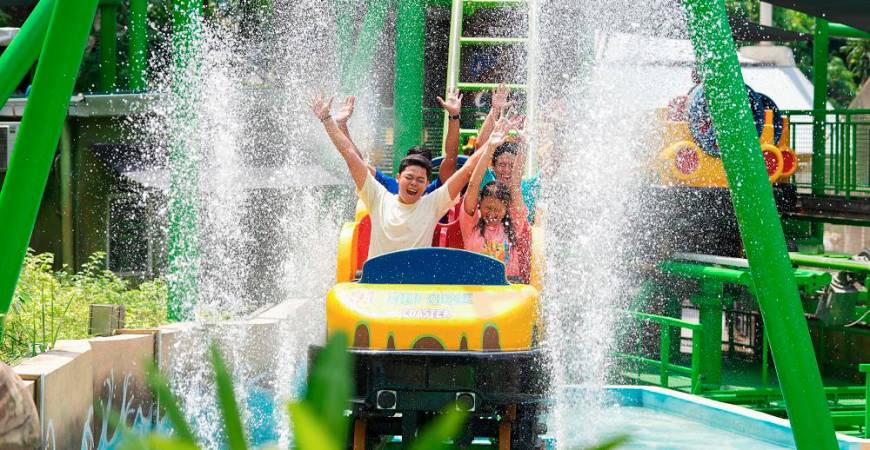 The Wild Chase Water Coaster offers a blend of coaster thrills and splashing fun in a lush tropical setting.