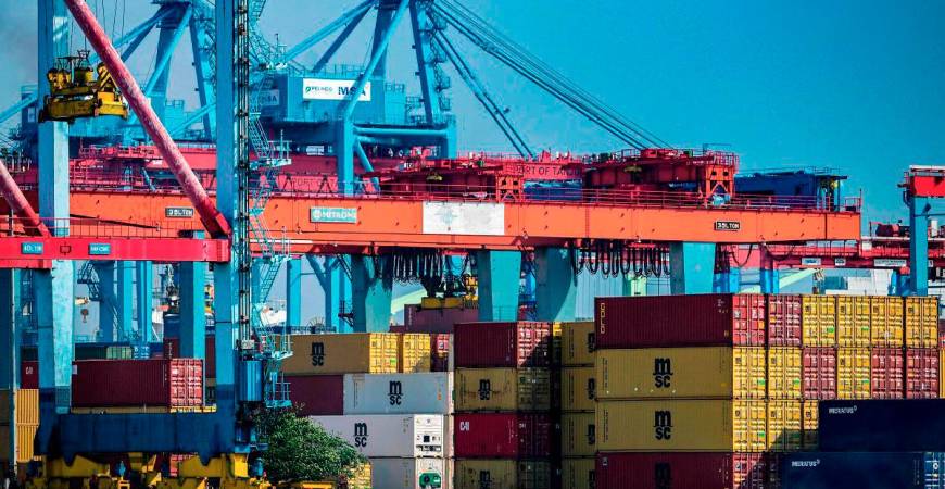 Stacks of cargo containers are kept at the Jakarta International Container Terminal in Tanjung Priok Port, Jakarta on July 7, 2025. - Bay ISMOYO / AFP