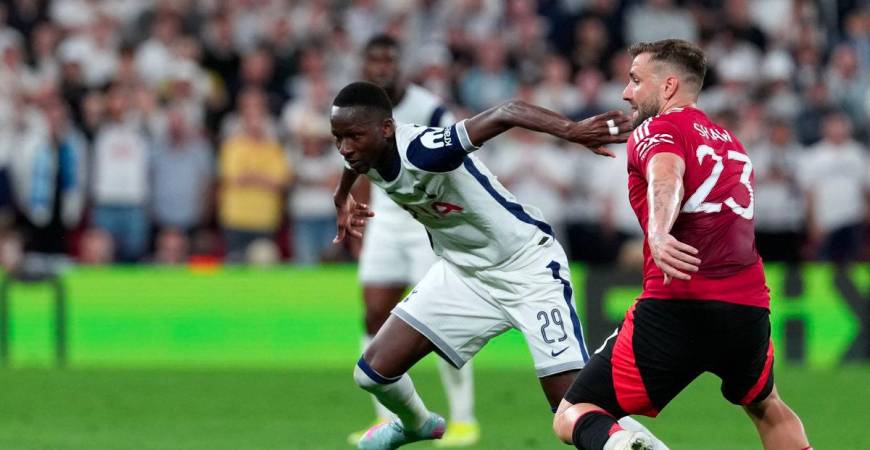 Tottenham Hotspur's Senegalese forward #29 Pape Matar Sarr and Manchester United's English defender #23 Luke Shaw vie for the ball during the UEFA Europa League final football match between Tottenham Hotspur and Manchester United at San Mames stadium in Bilbao on May 21, 2025. - AFPPIX