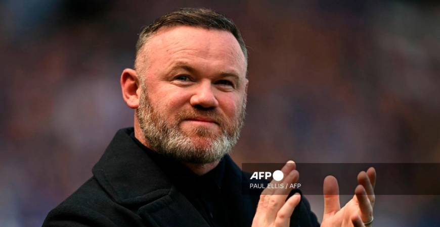 Former Everton player Wayne Rooney arrives on the pitch for the celebrations after the English Premier League football match between Everton and Southampton at Goodison Park in Liverpool, north west England on May 18, 2025, Everton's final premier league fixture played at the stadium, their home since 1892. - AFP