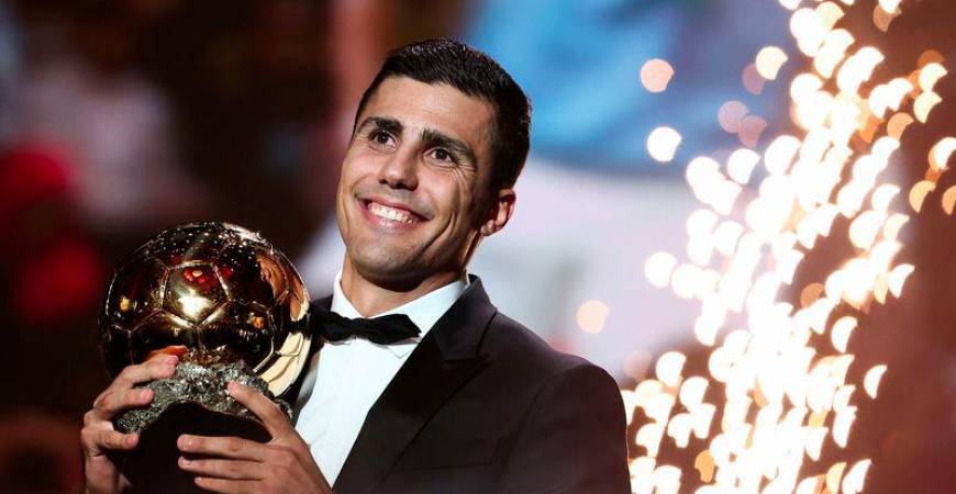 Manchester City's Spanish midfielder Rodri receives the Ballon d'Or award during the 2024 Ballon d'Or France Football award ceremony at the Theatre du Chatelet in Paris on October 28, 2024. - AFPPIX