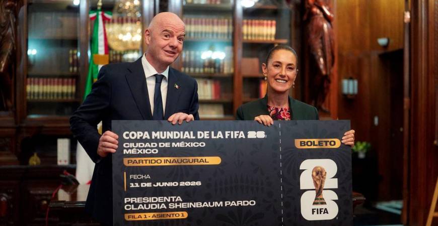 Handout picture released By Mexican Presidency shows Mexico's President Claudia Sheinbaum and FIFA President Gianni Infantino pose for pictures with a giant ticket at the National Palace in Mexico City on August 28, 2025. Mexico is co-hosting the 2026 FIFA World Cup with US and Canada. - AFPPIX/Mexican Presidency/Handout