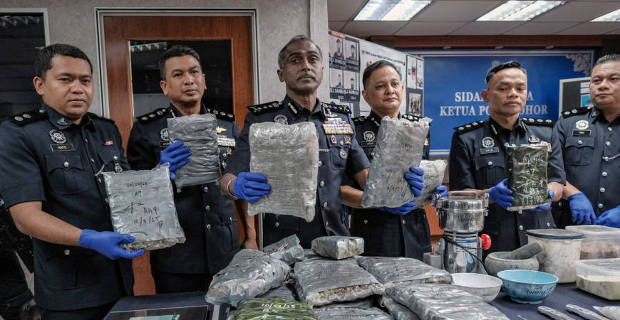 Johor Police Chief Datuk M. Kumar (third from left) shows the seized marijuana during a press conference on the success of drug seizures and the crackdown on criminal activities through Operation Bugil at the Johor Police Contingent Headquarters (IPK) today. - BERNAMA