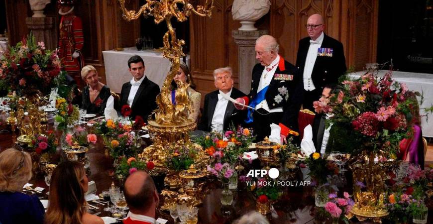 US President Donald Trump looks on as Britain’s King Charles III delivers a speech during a State Banquet at Windsor Castle, in Windsor, on September 17, 2025, during the US President’s second State Visit. (Photo by Yui Mok / POOL / AFP)