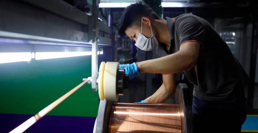 An employee works on the production line for copper flat wire at the Wellascent factory in Ganzhou, Jiangxi province, China August 14, 2025. - REUTERS