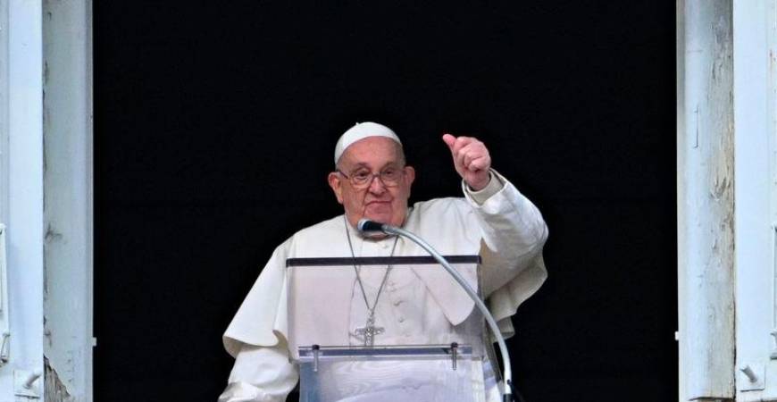 Pope Francis gestures to the crowd from the window of the Apostolic Palace overlooking St Peter’s Square during the Epiphany Angelus prayer, in the Vatican, on January 6, 2025. - AFPpix