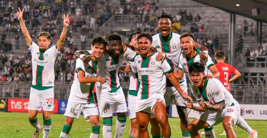 The action of Kuching City FC players after scoring a goal in the final minutes of the FA Cup match at the State Stadium last night. - BERNAMA