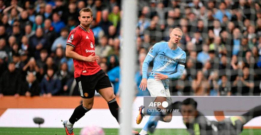 Manchester City's Norwegian striker #09 Erling Haaland (C) shoots but misses the target in the first moments of the English Premier League football match between Manchester City and Manchester United at the Etihad Stadium in Manchester, north west England, on September 14, 2025. - AFP