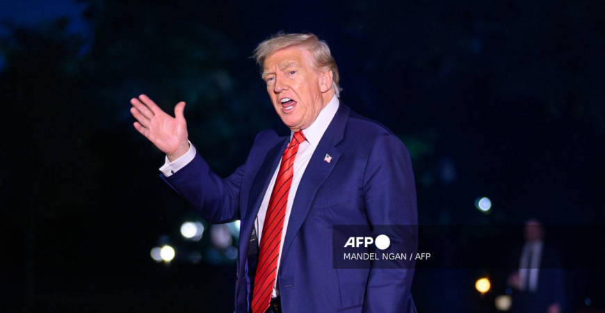 US President Donald Trump waves as he walks across the South Lawn upon return to the White House in Washington, DC on August 3, 2025 after spending the weekend at his Bedminster residence. - AFP