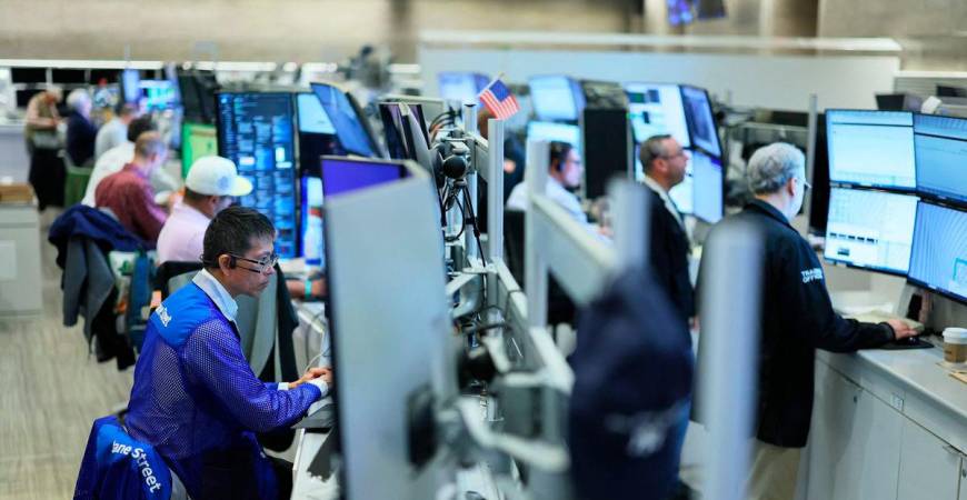 Traders work on the floor of the New York Stock Exchange on July 08, 2025 in New York City. (Photo by Michael M. Santiago / GETTY IMAGES NORTH AMERICA / AFP)
