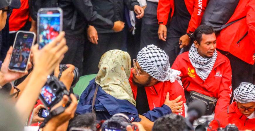 EMOTIONAL WELCOME ... One of the 23 Malaysian volunteers detained by Israeli forces during the Global Sumud Flotilla mission is greeted by a relative on arrival at the KL International Airport. – ADAM AMIR HAMZAH/THESUN