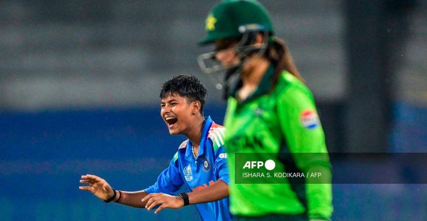 India's Kranti Goud (L) celebrates after taking the wicket of Pakistan's Aliya Riaz (R) during the ICC Women's Cricket World Cup 2025 one-day international (ODI) match between India and Pakistan at the R. Premadasa International Cricket Stadium in Colombo on October 5, 2025. - AFP