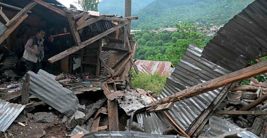 A local resident inspects the debris of his house that was destroyed by Pakistani artillery shelling at the Lagama village in Uri, about 100kms from Srinagar, on May 9, 2025. India and Pakistan accused each other on May 8 of carrying out waves of drone attacks, as deadly confrontations between the nuclear-armed foes drew global calls for calm. - AFPPIX