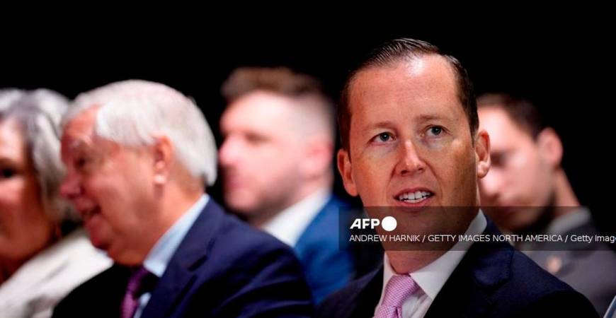 Assistant to the President Sergio Gor (R), accompanied by Sen. Lindsey Graham (R-SC) (L), waits before U.S. President Donald Trump arrives for an event at the Kennedy Center on August 13, 2025 in Washington, DC. - Getty Images via AFP