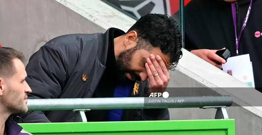 Manchester United's Portuguese head coach Ruben Amorim reacts in his seat during the English Premier League football match between Brentford and Manchester United at the Gtech Community Stadium in London on September 27, 2025. - AFP