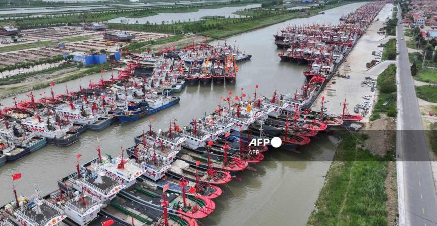 Fishing boats shelter at a fishing port ahead of the arrival of Typhoon Co-May in Lianyungang, in China’s eastern Jiangsu province on July 30, 2025. - AFP / China OUT