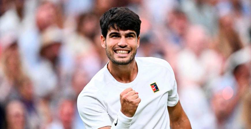 Spain’s Carlos Alcaraz celebrates winning a game against Russia’s Andrey Rublev during their men’s singles fourth round tennis match on the seventh day of the 2025 Wimbledon Championships at The All England Lawn Tennis and Croquet Club in Wimbledon, southwest London, on July 6, 2025. - AFP