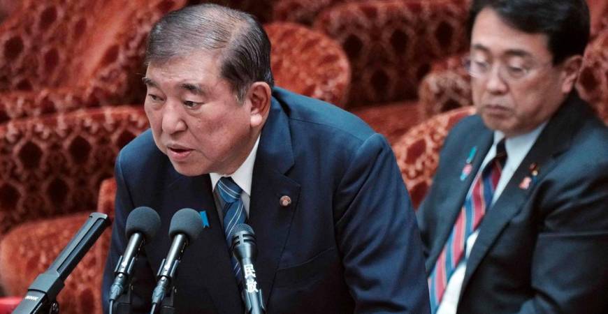 Japan's Prime Minister Shigeru Ishiba (L) and Economic Revitalization Minister and chief negotiator in trade tariff talks Ryosei Akazawa (R) attend a budget committee session on the US tariff issue in the House of Representatives at the Parliament in Tokyo on August 4, 2025. - AFPPIX