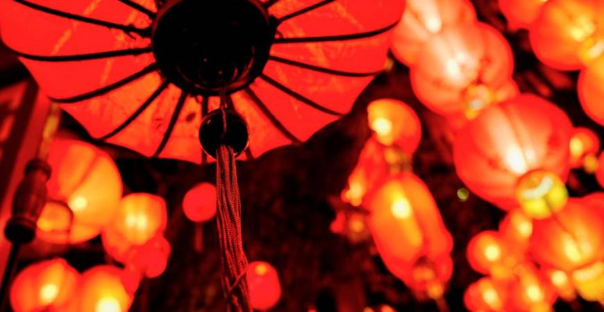 Bright red lanterns light the way for happiness and good luck.