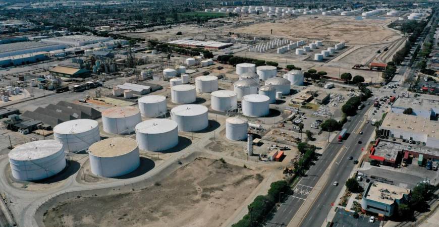 FILE PHOTO: An aerial view of storage tanks at the Kinder Morgan Watson Station, a gathering system for oil and refined petroleum product pipelines, in Long Beach, California, U.S., March 11, 2022. Picture taken with a drone. REUTERS