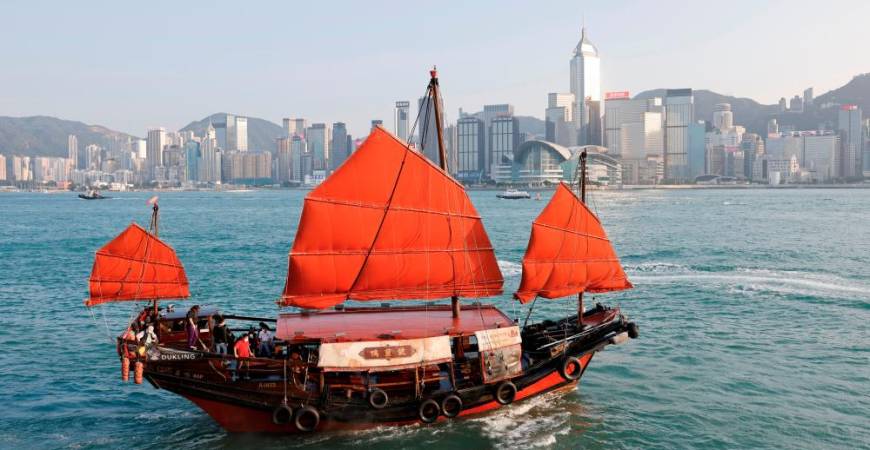 A traditional wooden tourist junk boat “Dukling”, sails in the waters of Victoria Harbour, during the COVID-19 pandemic, in Hong Kong, China October 31, 2020. Picture taken October 31, 2020. REUTERS/Tyrone Siu