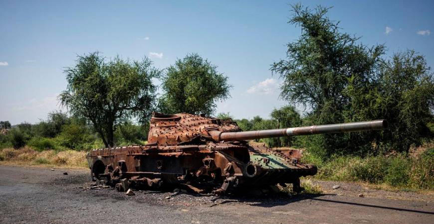 The charred remaining of a T-72 tank lay on the road that connects Shiraro to Shire on October 12, 2024. The two-year war in Ethiopia's Tigray region left hundreds of thousands people dead, more than one million still displaced and cost more than $20 billion in damage, until a peace deal in November 2022 ended the bloodshed.The war erupted in November 2020 when Prime Minister Abiy Ahmed sent the army to overthrow the leaders of the northern Tigray region, accusing their forces of attacking federal military bases. - Michele Spatari / AFP