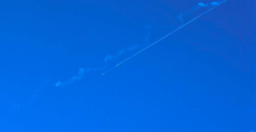 A missile fired from Iran leaves a trail in the sky above nablus city in the occupied West Bank on June 19, 2025. - Zain JAAFAR / AFP