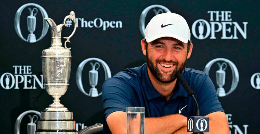 US golfer Scottie Scheffler with the Claret Jug, the trophy for the Champion golfer of the year beside him, holds a press conference after his victory in the 153rd Open Championship at Royal Portrush golf club in Northern Ireland on July 20, 2025 - AFP