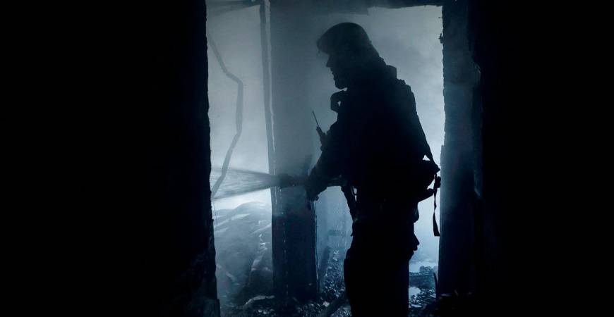A firefighter works at the site of the building hit by a Russian drone strike, amid Russia’s attack on Ukraine, in Kharkiv, Ukraine July 7, 2025. - REUTERS/Sofiia Gatilova