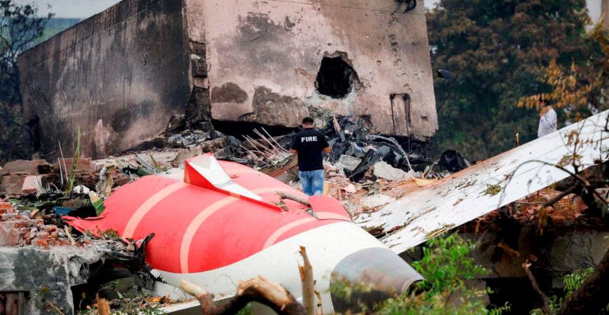 FILE PHOTO: A firefighter stands next to the crashed Air India Boeing 787-8 Dreamliner aircraft, in Ahmedabad, India, June 13, 2025. REUTERS