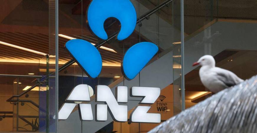 FILE PHOTO: An Australia and New Zealand Banking Group Limited (ANZ) logo is displayed in a branch window in Sydney, Australia, September 9, 2025. REUTERS/Hollie Adams/File Photo
