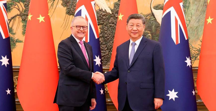 Chinese President Xi Jinping and Australian Prime Minister Anthony Albanese shake hands at the Great Hall of the People in Beijing, China July 15, 2025. - China Daily via REUTERS