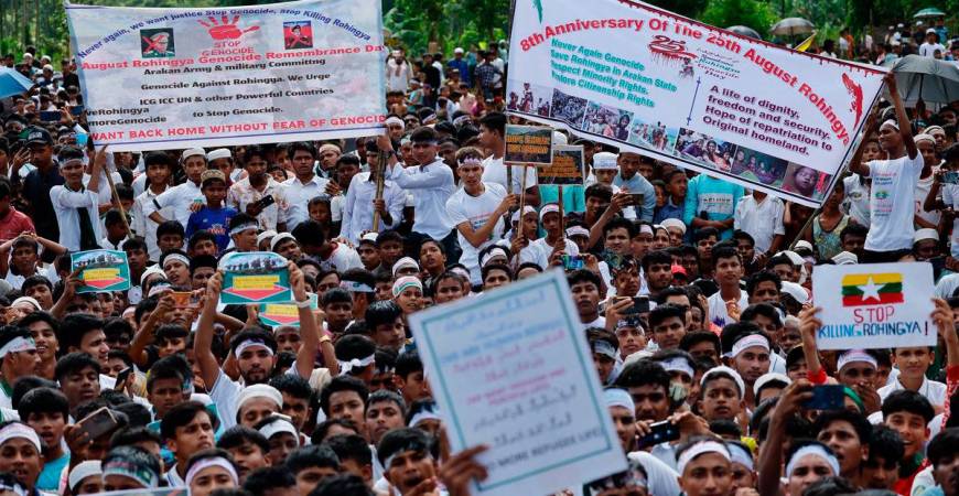 Rohingya refugees hold banners and placards while taking part in a protest rally inside a refugee camp to mark the eight-year anniversary of their exodus, in Cox’s Bazar, Bangladesh, August 25, 2025. REUTERS/Mohammad Ponir Hossain