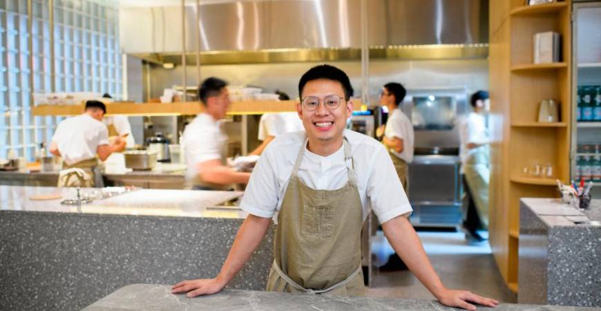Wong smiling for a picture in front of his kitchen. – PHOTO COURTESY OF JORDAN LYE PHOTOGRAPHY