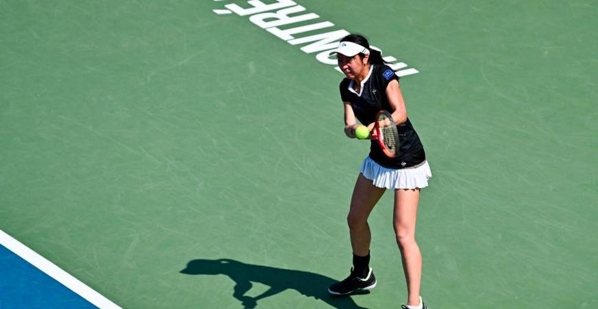 Aoi Ito of Japan plays a backhand against Jasmine Paolini of Italy during their second round match on Day Three of the WTA 1000 National Bank Open at IGA Stadium on July 29, 2025 in Montreal, Quebec, Canada. - AFPPIX