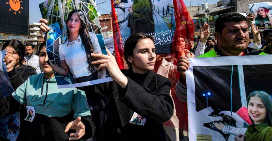 People gather for a mass demonstration in Syria’s northeastern city of Qamishli on March 11, 2025 protesting against a recent wave of sectarian violence targeting Syria’s Alawite minority in the west of the country along the Mediterranean sea coast. (Photo by Delil SOULEIMAN / AFP)