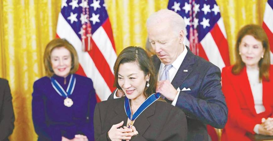 Biden presents the Presidential Medal of Freedom to Yeoh in the East Room of the White House in Washington, DC last Friday. – AFPPIC