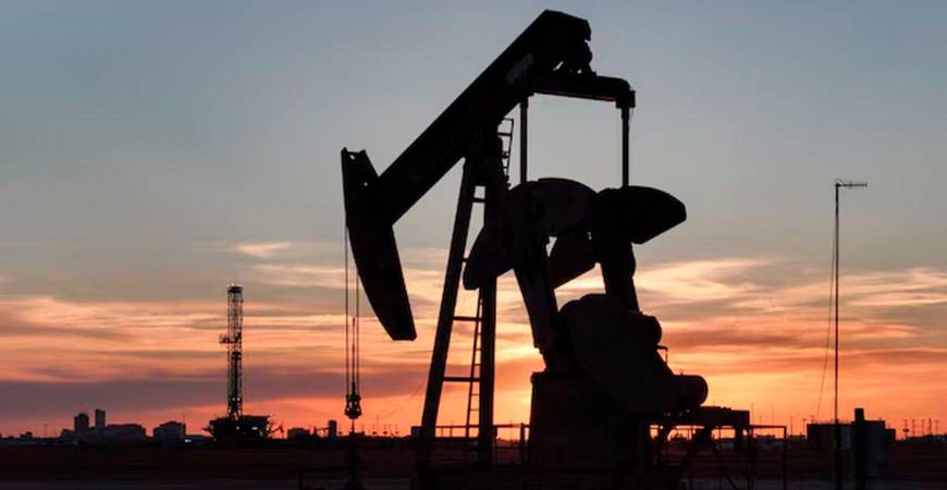 A drone view of a pump jack and drilling rig south of Midland, Texas, U.S. June 11, 2025. - REUTERS/Eli Hartman/ File Photo