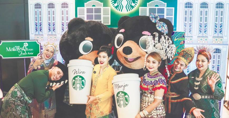 Mascots Wira and Manja with Starbucks Malaysia Hospitality Specialists.