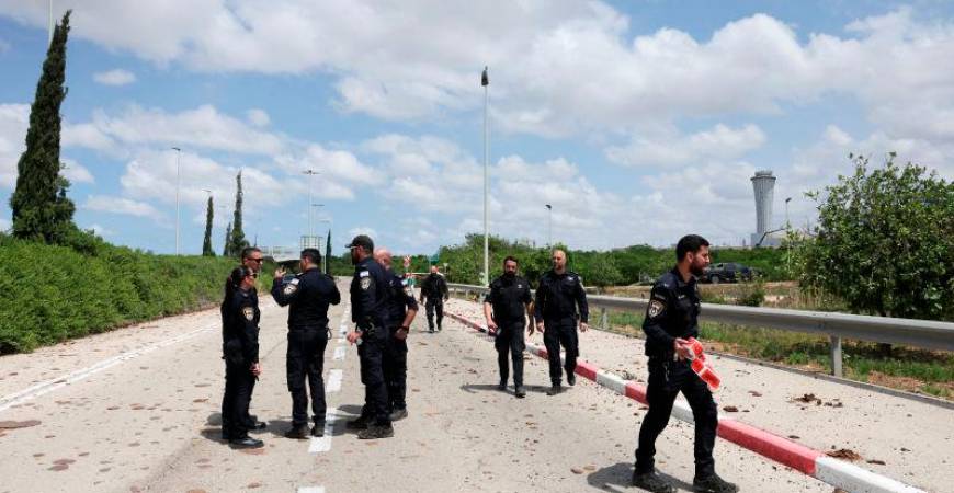 Security forces work at the site of a missile attack, launched from Yemen, at the entrance of Ben Gurion Airport, in Tel Aviv, Israel May 4, 2025. REUTERSpix