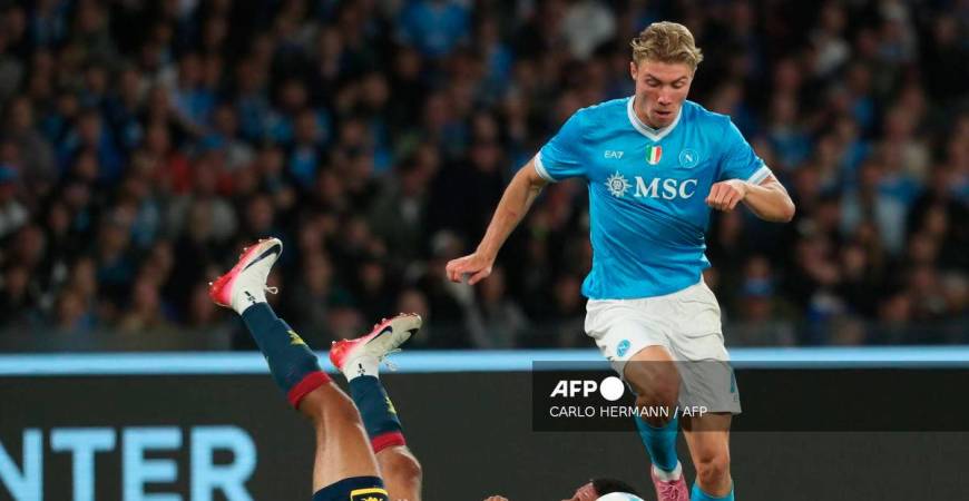 Napoli's Danish forward #19 Rasmus Hojlund fights for the ball with Genoa's Danish defender #34 Sebastian Otoa during the Italian Serie A football match between SSC Napoli and Genoa CFC at the Diego Armando Maradona Stadium on October 5, 2025. - AFP