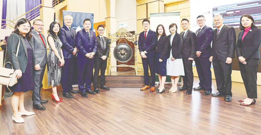 Chan (sixth from left) with his directors, management team and Alliance Islamic Bank officials at the listing.