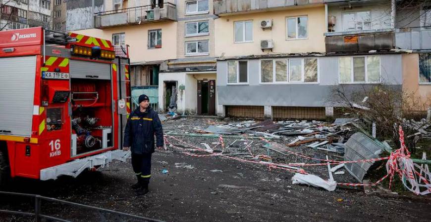 A firefighter works at a site of an apartment building hit by a Russian drone strike, amid Russia’s attack on Ukraine, in Kyiv - REUTERSpix