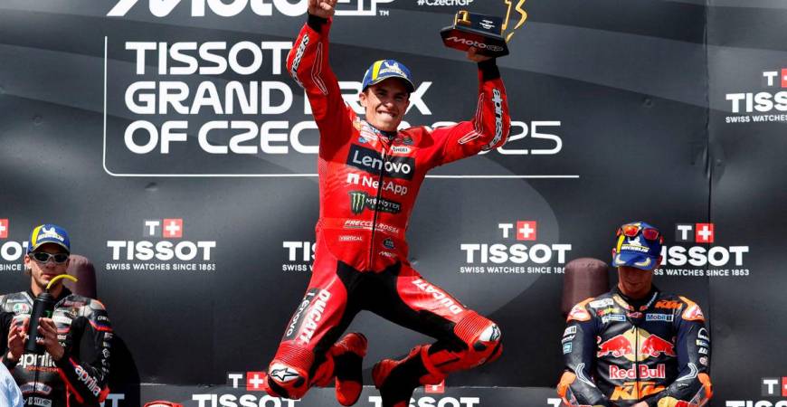 Ducati Lenovo Team’s Marc Marquez celebrates with a trophy on the podium after winning the MotoGP race REUTERS/David W Cerny TPX IMAGES OF THE DAY
