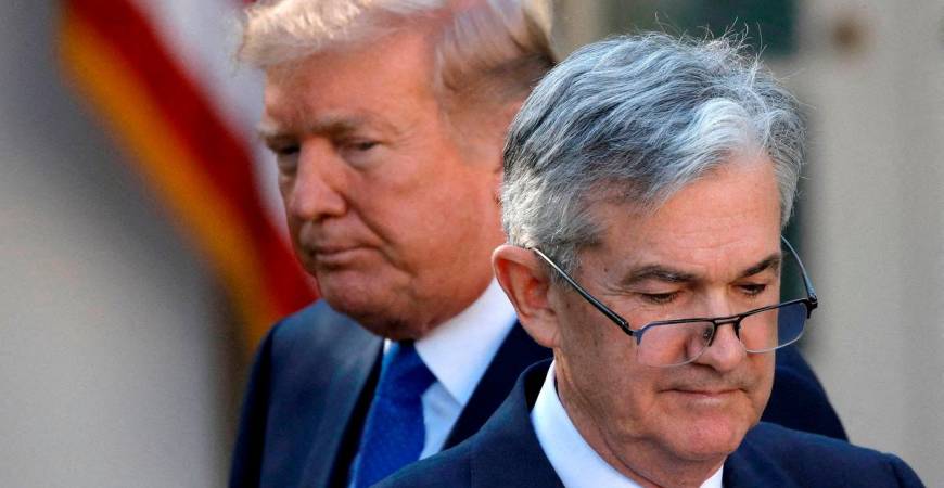 FILE PHOTO: U.S. President Donald Trump looks on as Jerome Powell, his nominee at the time to lead the U.S. Federal Reserve, moves to the podium at the White House in Washington, U.S., November 2, 2017. REUTERS