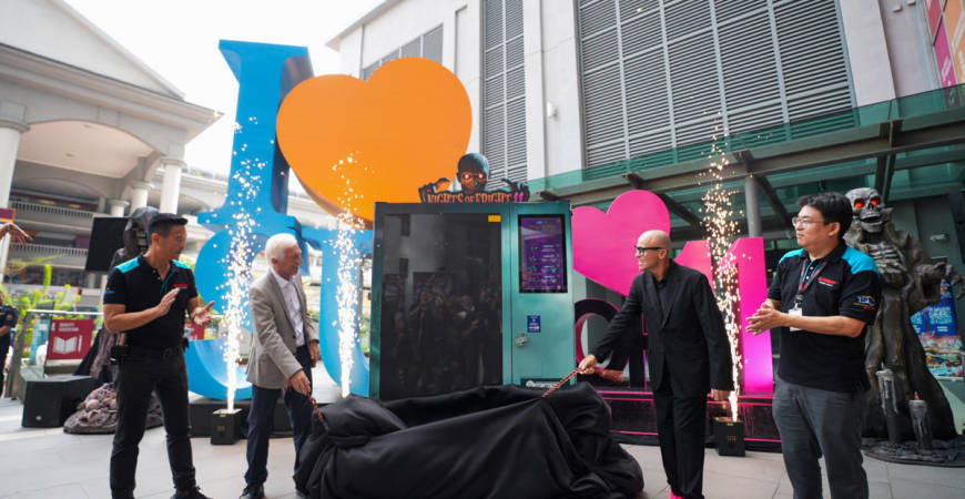 Professor Sibrandes Poppema, President of Sunway University, and Mr. Lynton V. Harris, Founder and Chief Executive Officer of The Sudden Impact Entertainment Company, lead the dramatic reveal of the NOF 11 vending machine, flanked by partners and key guests.