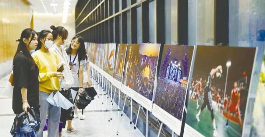 Visitors viewing some of the photos displayed at the exhibition.
