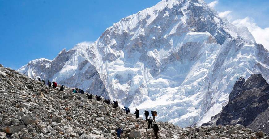 FILE PHOTO: Mountaineers and trekkers head towards the Everest base camp from Lobuche in the Solukhumbu district, also known as the Everest region, Nepal April 12, 2025. REUTERS/Purnima Shrestha/File Photo
