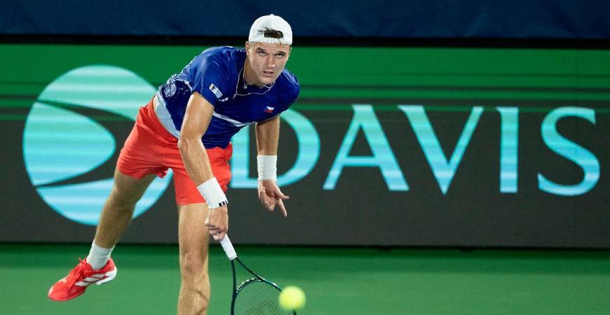 Jakub Mensik of Czechia serves the ball against Taylor Fritz of the United States in the second rubber of the Davis Cup tie between the USA and Czechia at Delray Beach Tennis Center. - Mullane-Imagn Images